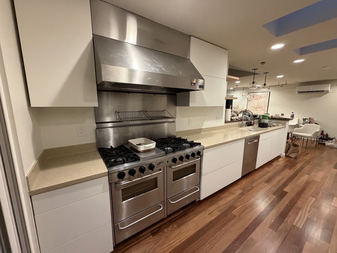 White galley kitchen around a pro range